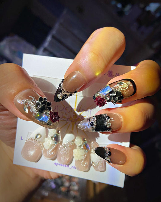 Noir Rose press-on nails: black French tip and chrome almond nails with 3D black and red roses